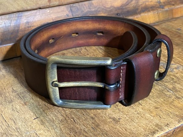 Leather belt with a patinated brass buckle