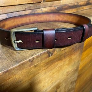 Leather belt with a patinated brass buckle