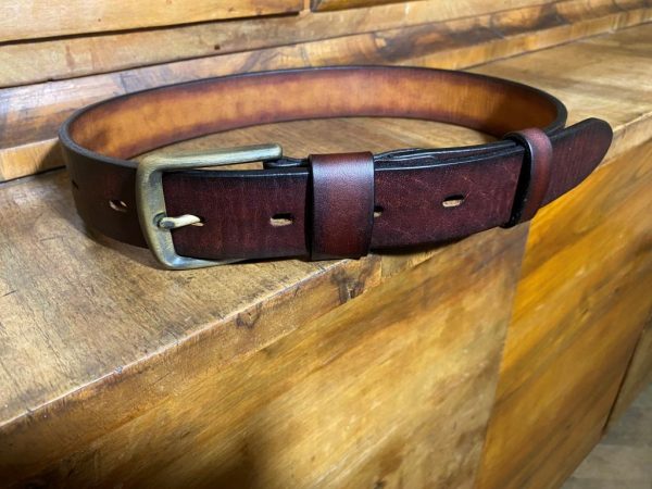 Leather belt with a patinated brass buckle