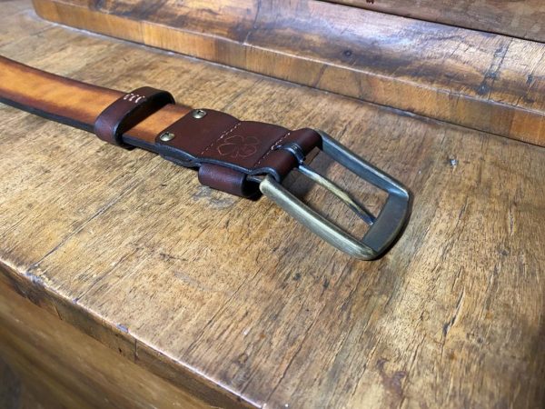 Leather belt with a patinated brass buckle