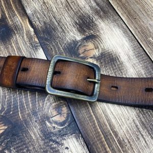 Vintage leather belt with a patinated brass buckle